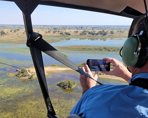 Guest using digital device at Sekala lodge