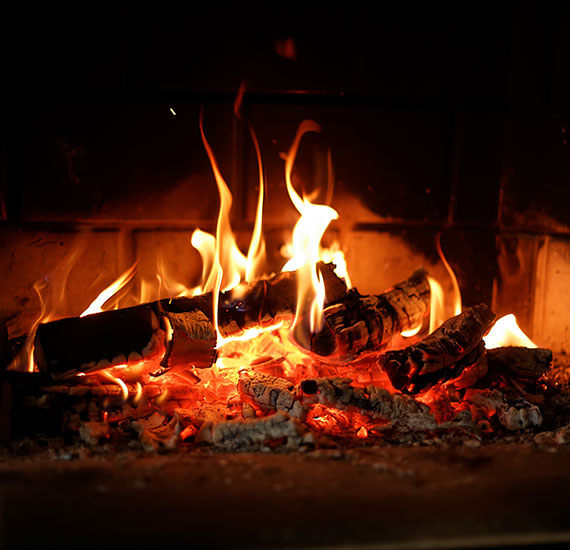 Guests relaxing by fireplace in Sekala lounge area