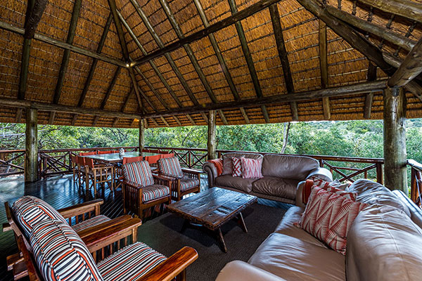 Spacious open air lounge area with African-inspired décor at Sekala